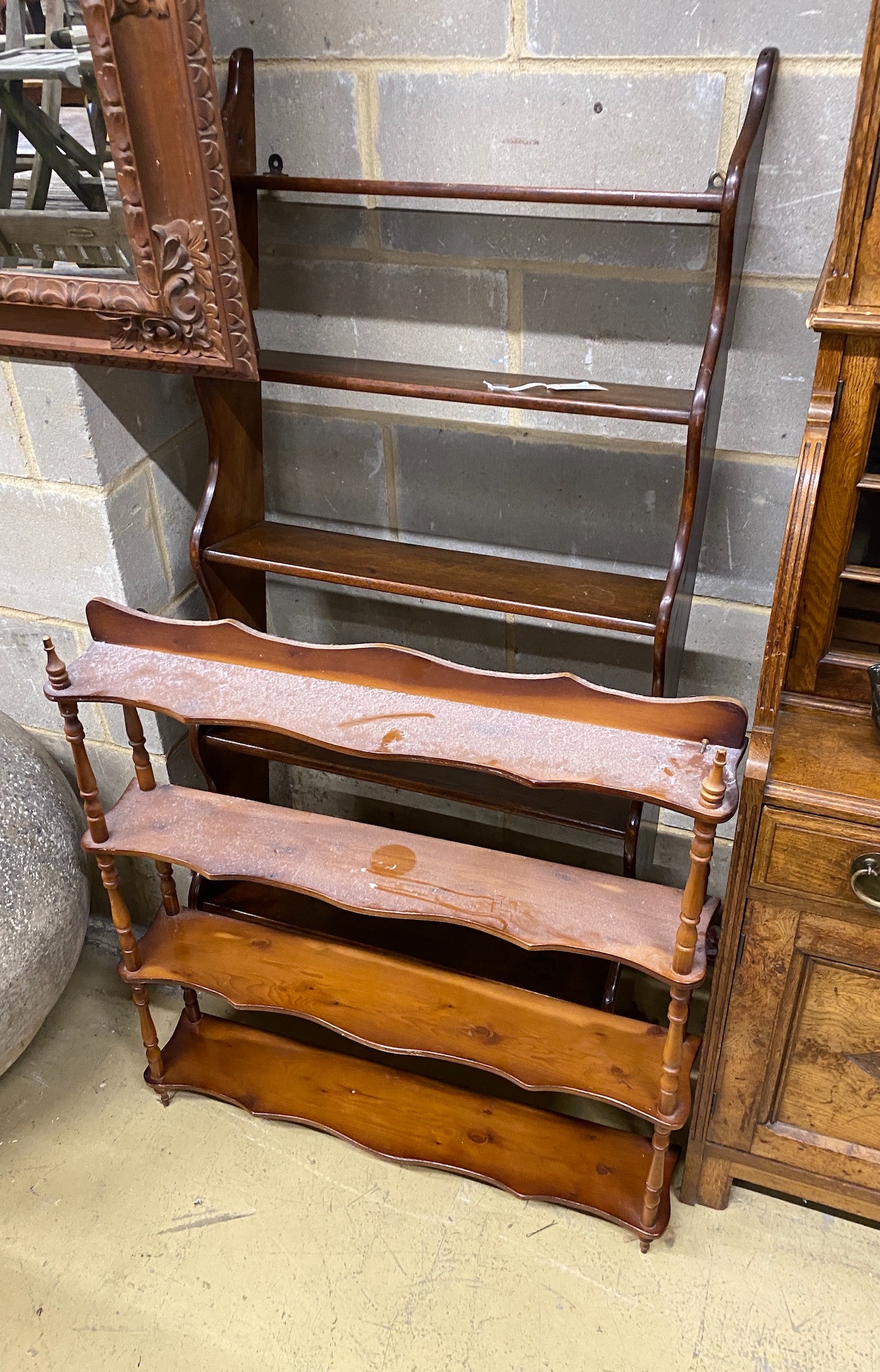 A Victorian mahogany five tier wall bracket, width 66cm, height 148cm together with a reproduction yew wall bracket